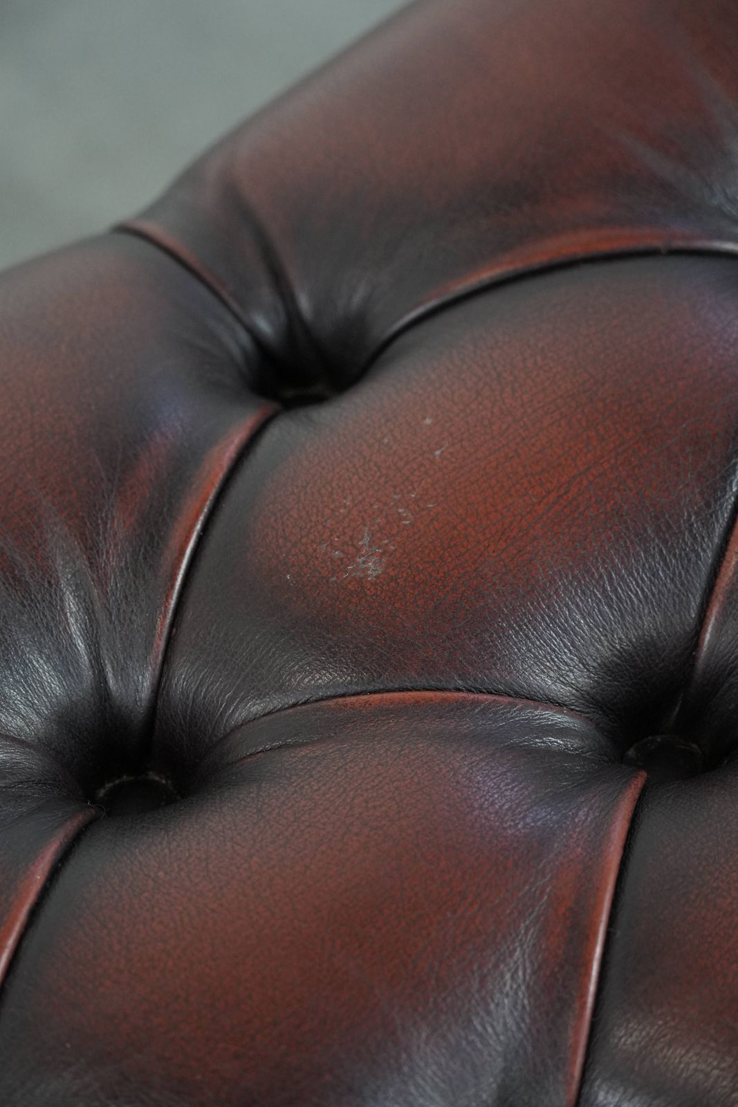 photo for sale Elegant And Graceful Dark Brown Chesterfield Footstool Made Of Cowhide