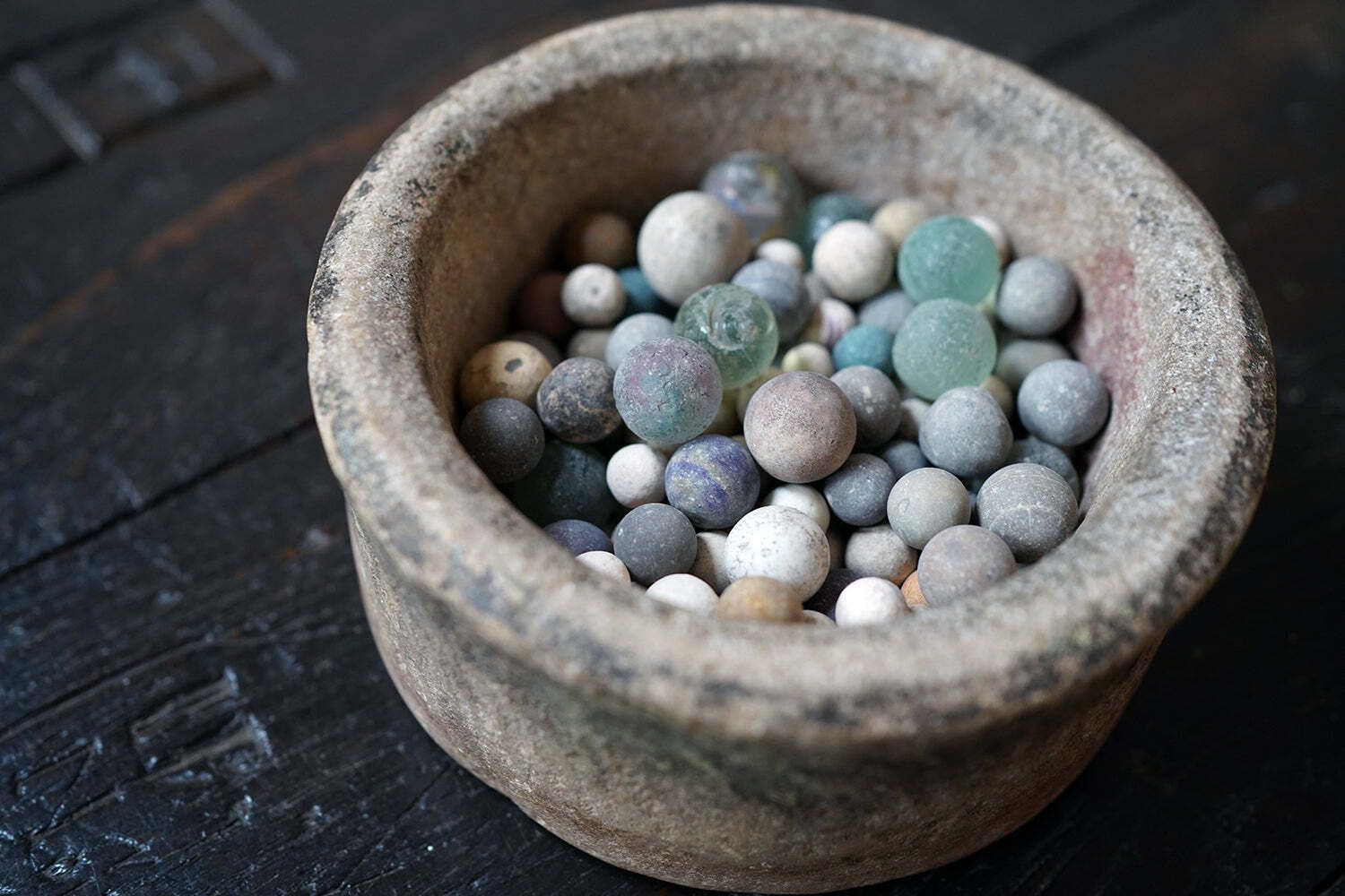 A Late 19thc Indian Marble Bowl Containing A Collection Of Clay & Glass Marbles photo for sale