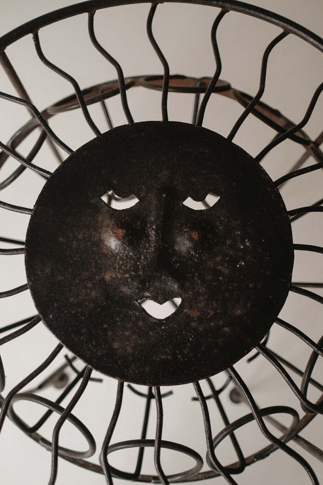 photo for sale Sculptural Iron Table With Sunburst Face