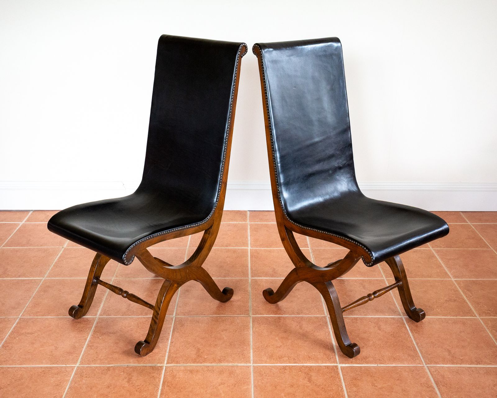 photo vinterior Pair Of Spanish Oak Leather Dining Chairs By Pierre Lottier Valmazan Mid Century Neoclassical Colonial 1960s Black Leather Sling Seat Studded Leather