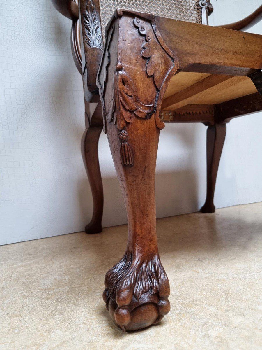 photo for sale Chippendale Bergere Armchair In Carved Mahogany With Caned Backrest And Lion's Claw And Ball