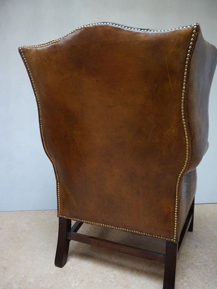 820.0 Mid Century Cognac Leather Chesterfield Wingback Armchair, 1960s photo