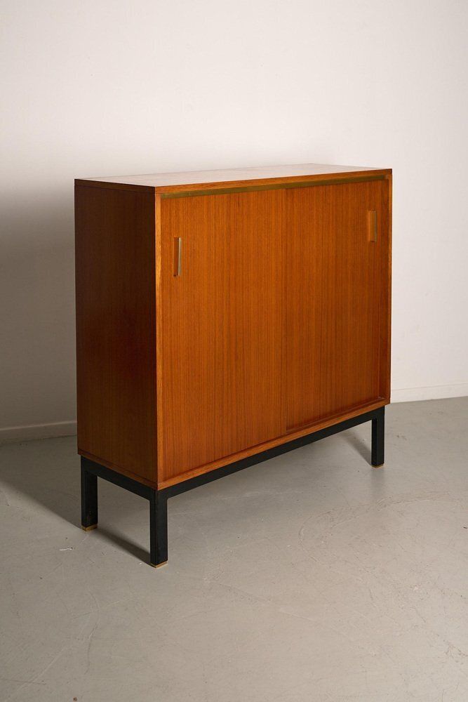 photo furniture Teak Cabinet With Brass Details And Black Metal Base, 1970s