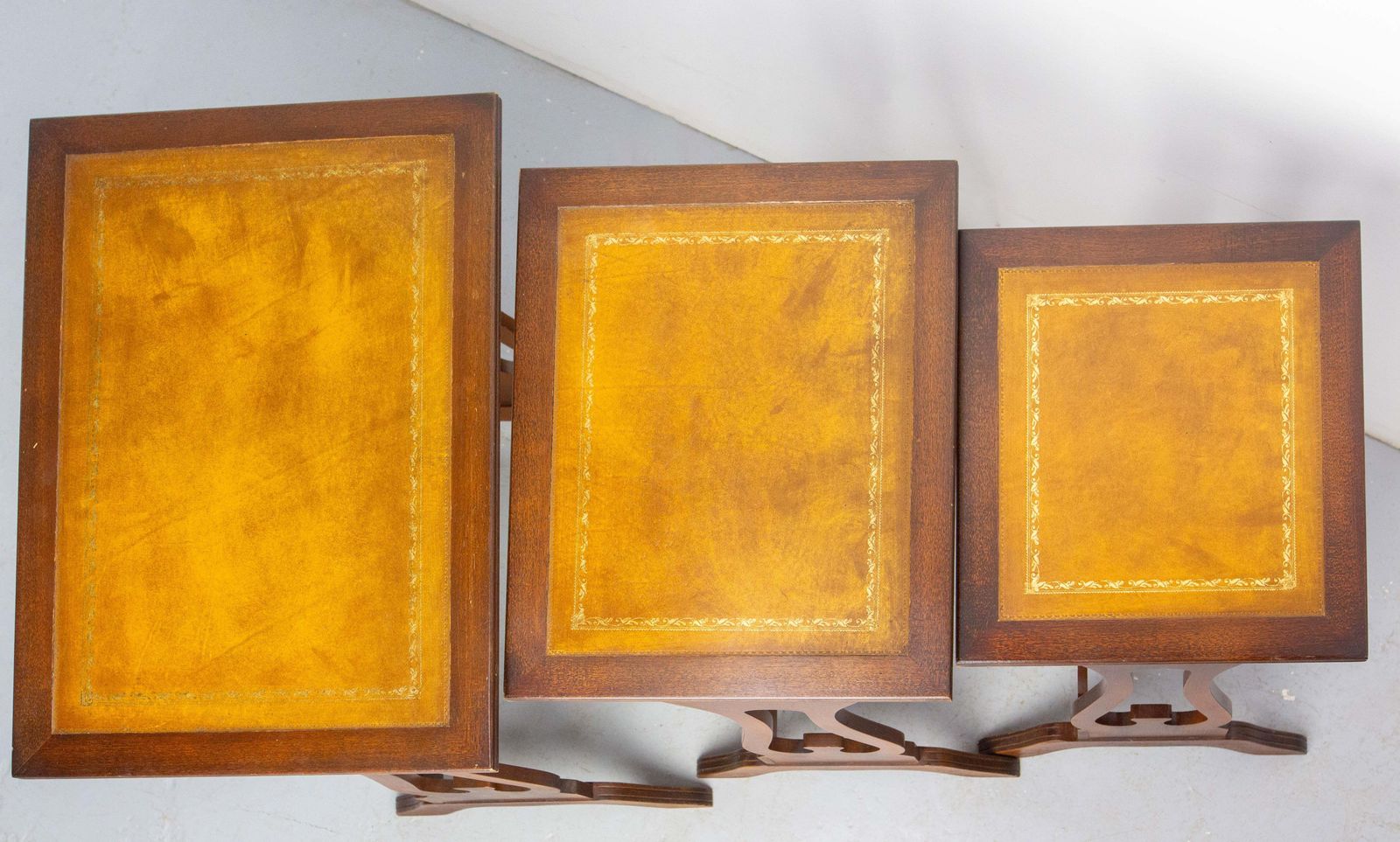 photo furniture Set Of Three Poplar Nesting Tables With Top Recovered Of Leather Mid Century