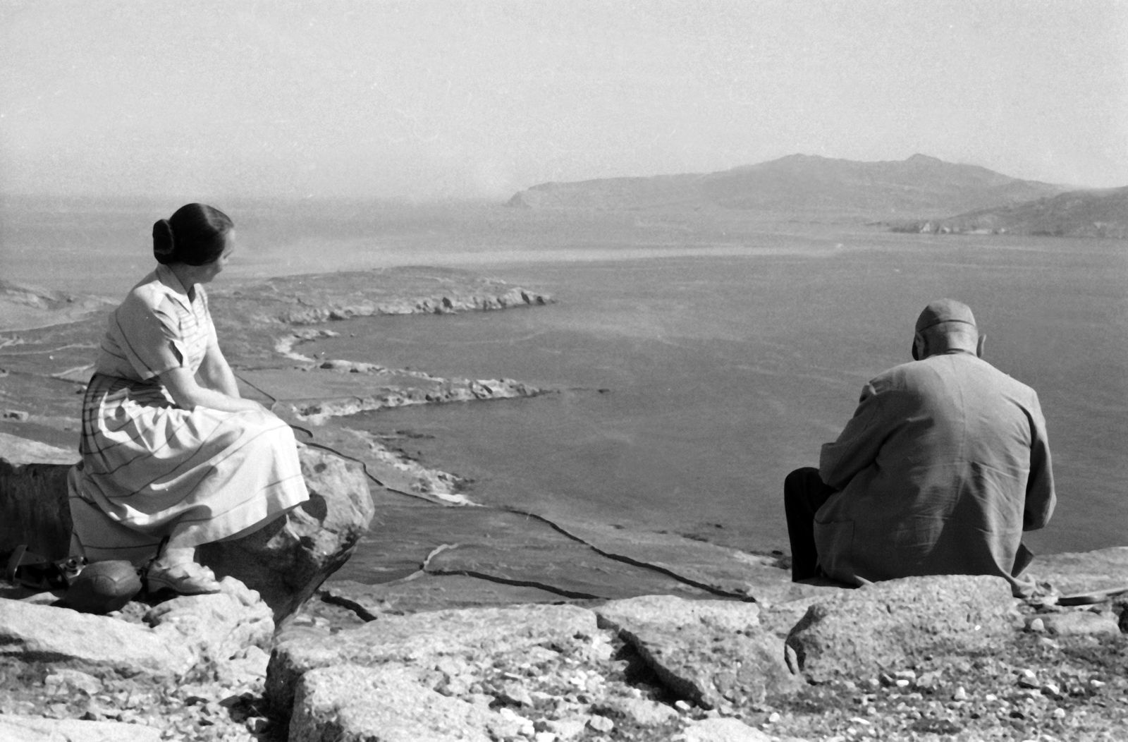 Erich Andresman And Woman Sitting On A Cliff At The Island Of Delos, Greece 1950s1952