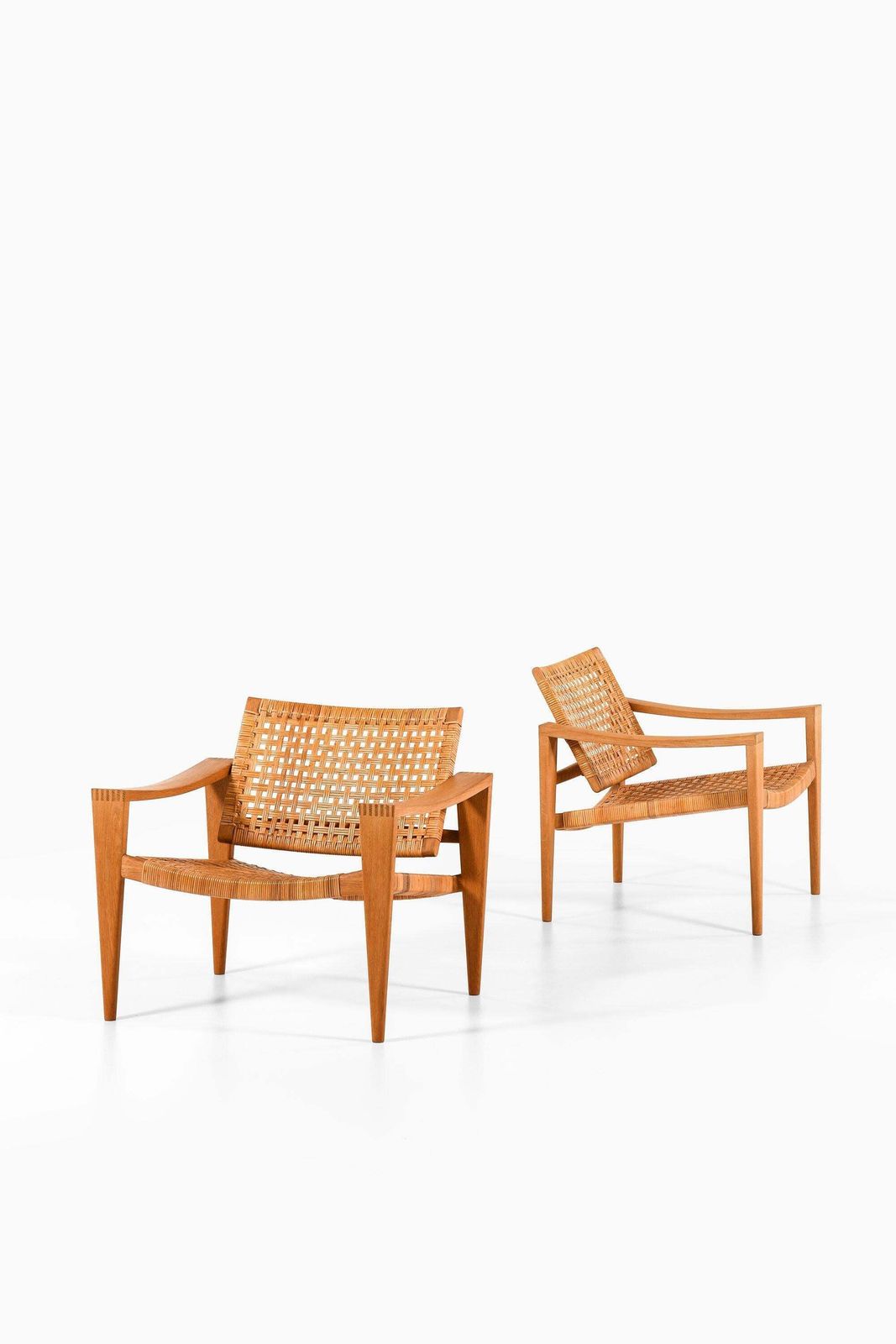 Pair Of Easy Chairs In Oak, Woven Cane, Brass And Leather By Hans Wegner, 1959 photo for sale