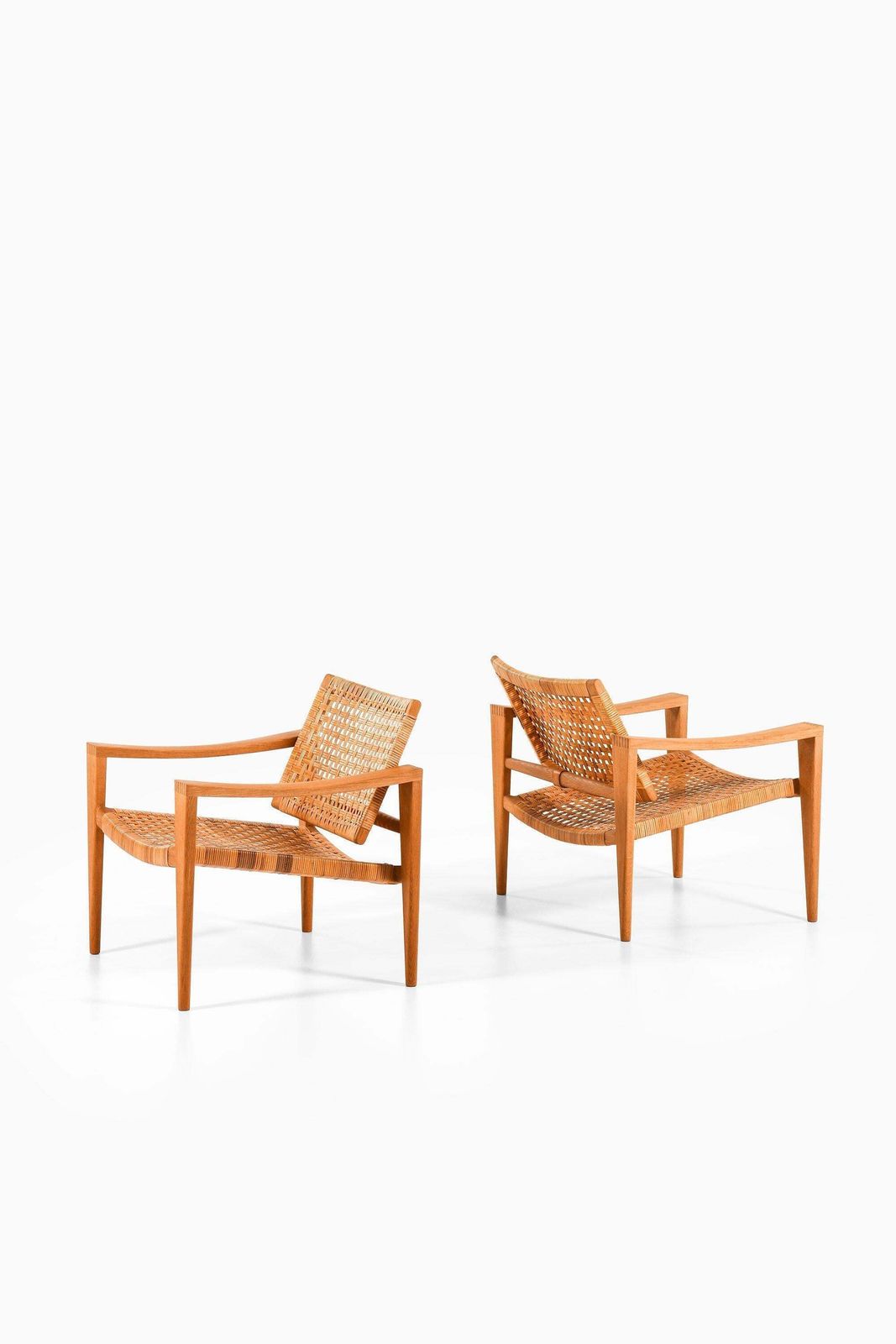 Pair Of Easy Chairs In Oak, Woven Cane, Brass And Leather By Hans Wegner, 1959 photo 189566.0