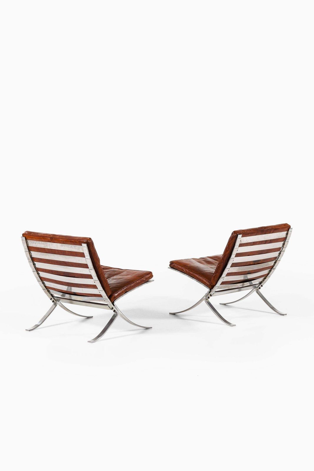 Pair Of Easy Chairs In Chromed Steel And Leather By Steen østergaard, 1960's photo for sale