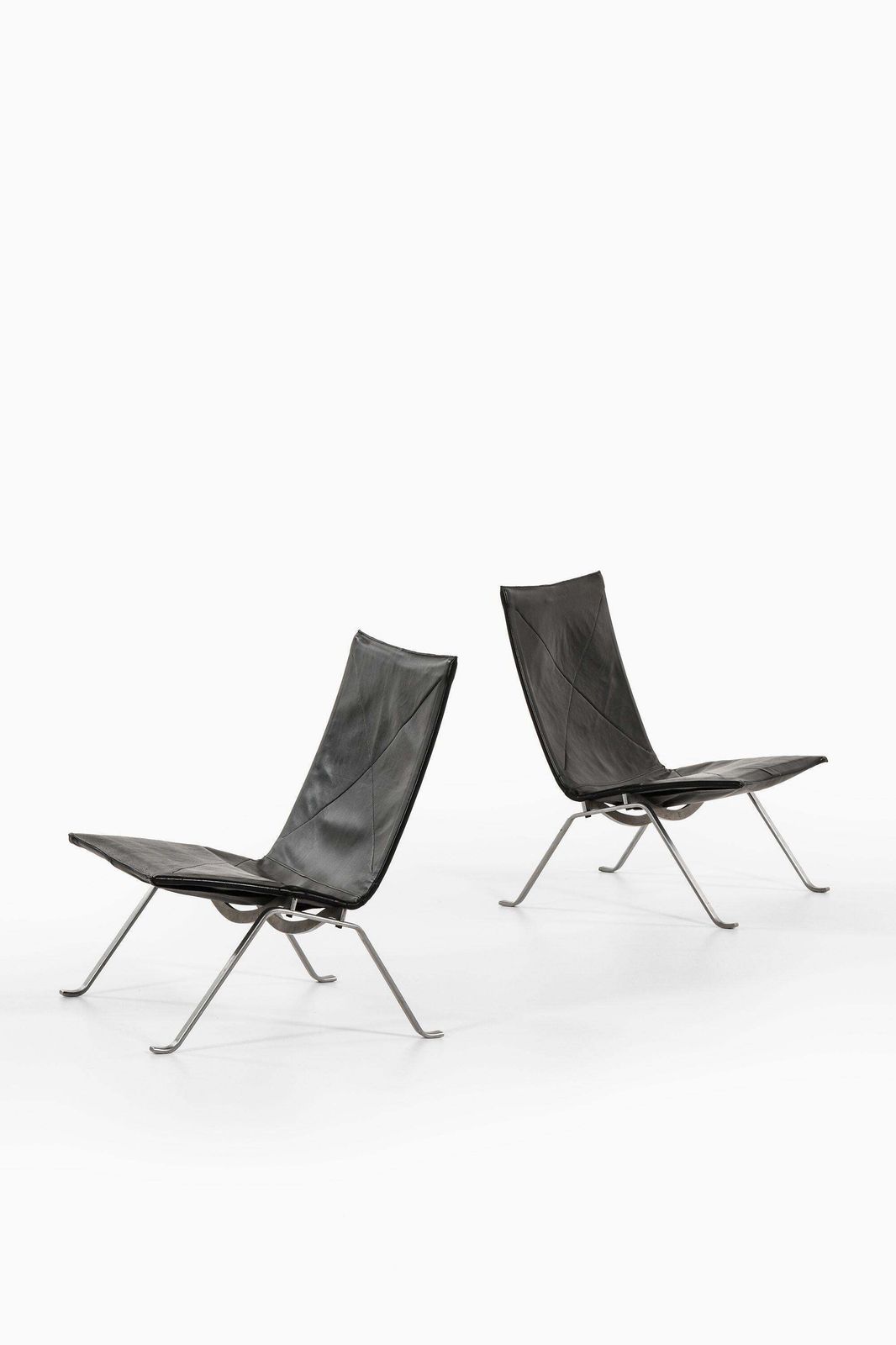 Pair Of Easy Chairs In Black Leather And Steel By Poul Kjærholm, 1950's photo furniture