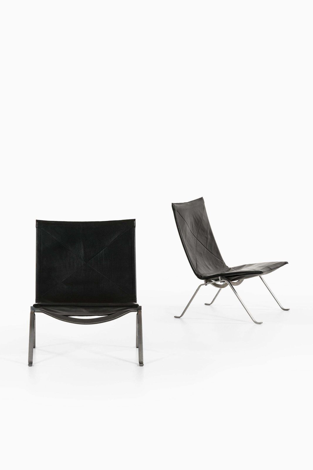 Pair Of Easy Chairs In Black Leather And Steel By Poul Kjærholm, 1950's photo for sale