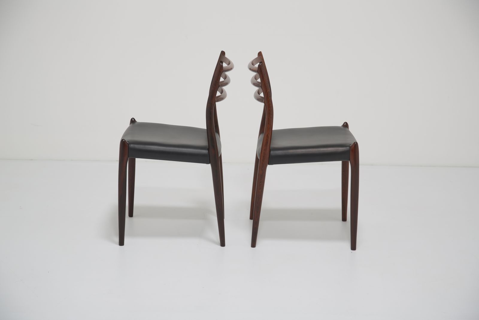 photo for sale Niels Otto Møller Model 78 Dining Chairs: Set Of 8 In Solid Rosewood And Black Leather For J.L. Møllers, 1960s.