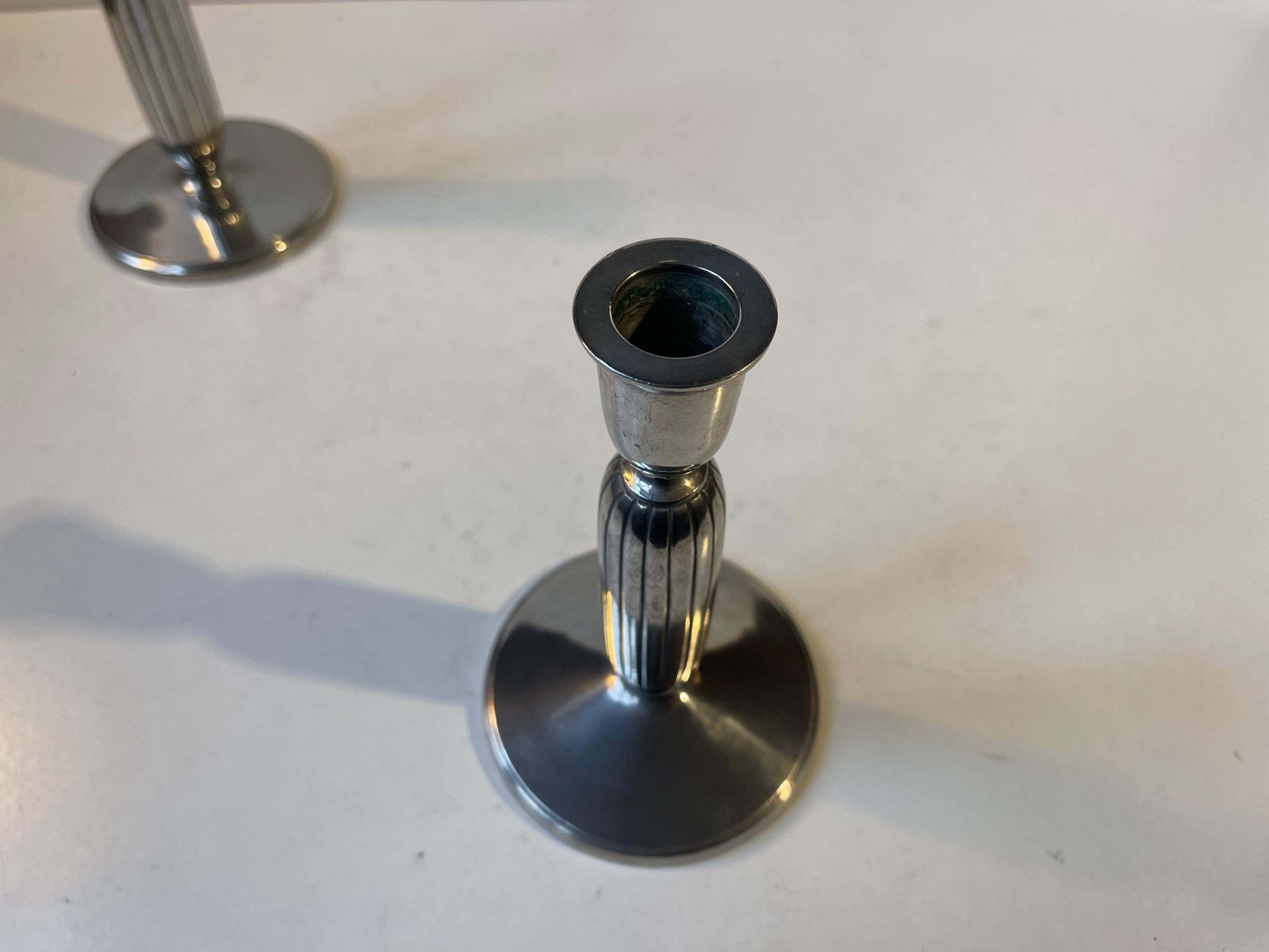 photo furniture Just Andersen   A Pair Of Art Deco Column Candlesticks In Pewter, 1930s