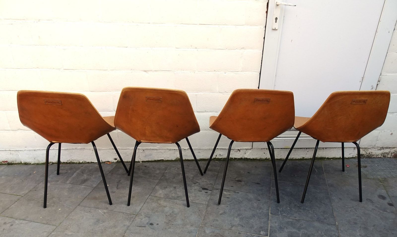 Furniture Vintage Cognac Leather Tonneau Chairs By Pierre Guariche, 1990s, Set Of 4 photo
