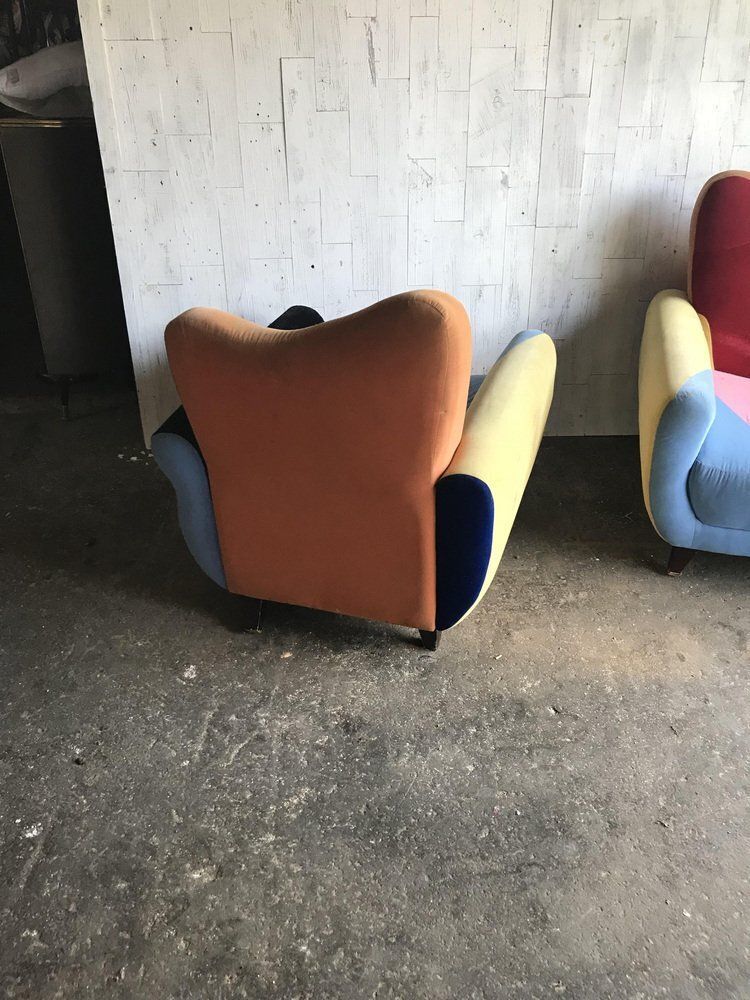 Set Of Mid Century Armchairs In Multicoloured Fabric With Black Painted Legs photo furniture