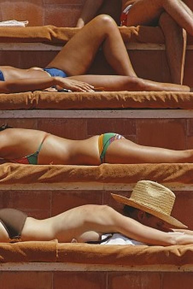 Slim Aarons Sunbathing In Capri, 1974   Sunbathers On French Island Of Capri Summer Bronzing photo for sale