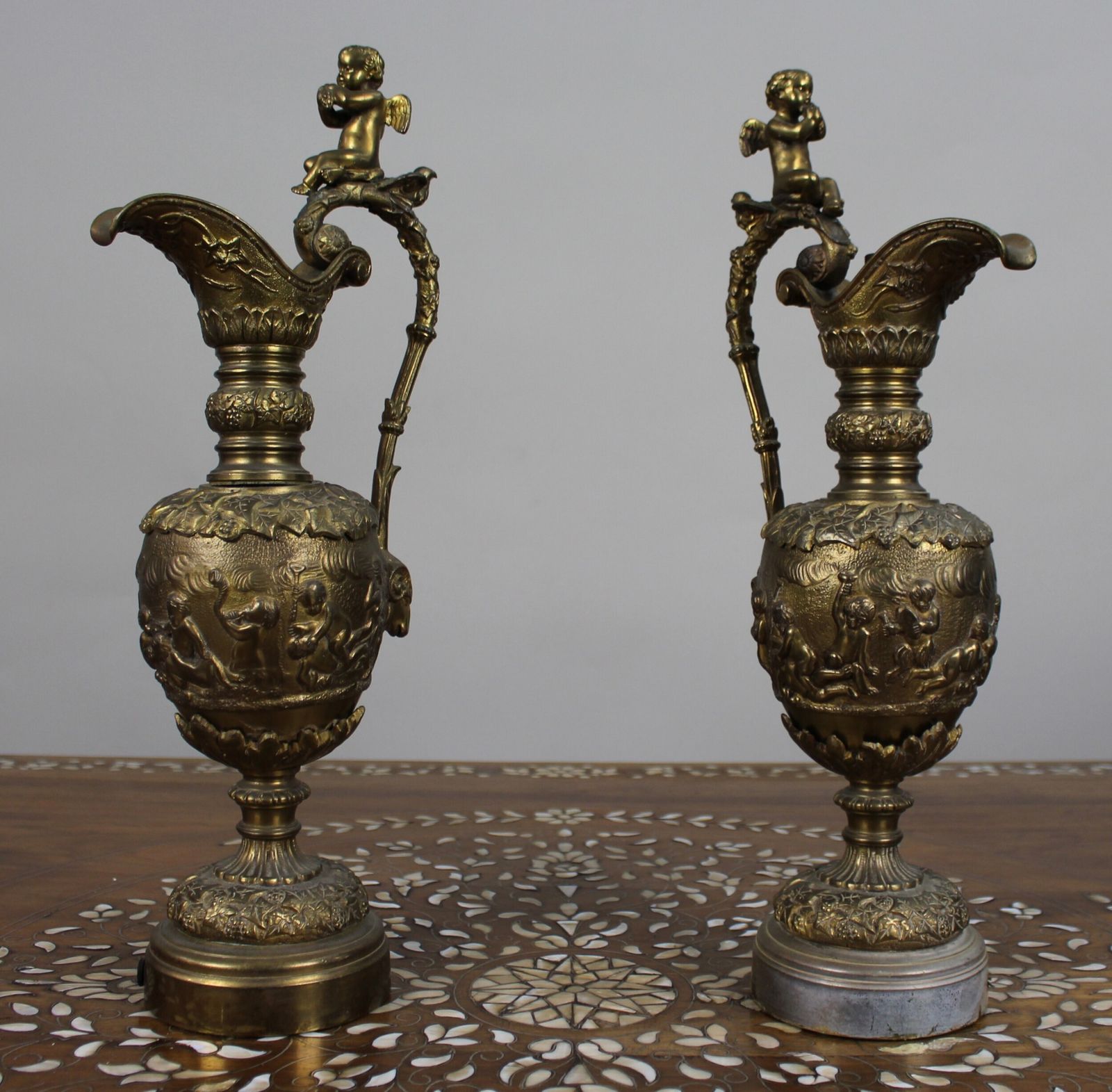 photo buy Pair Of 19th Century French Gilt Bronze Bacchanalian Ewers With Cherubs