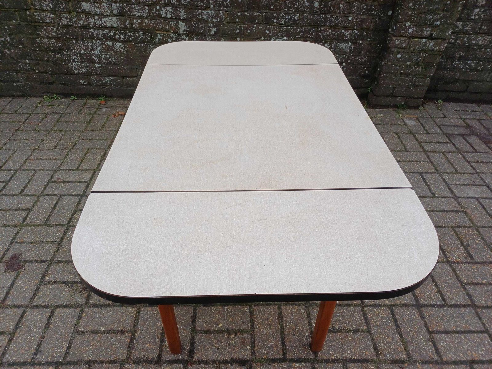 photo furniture 1960s Guildform Formica Kitchen Table With Folding Leaves Danish Oiled Wood Base Vintage Mid Century Dining Table