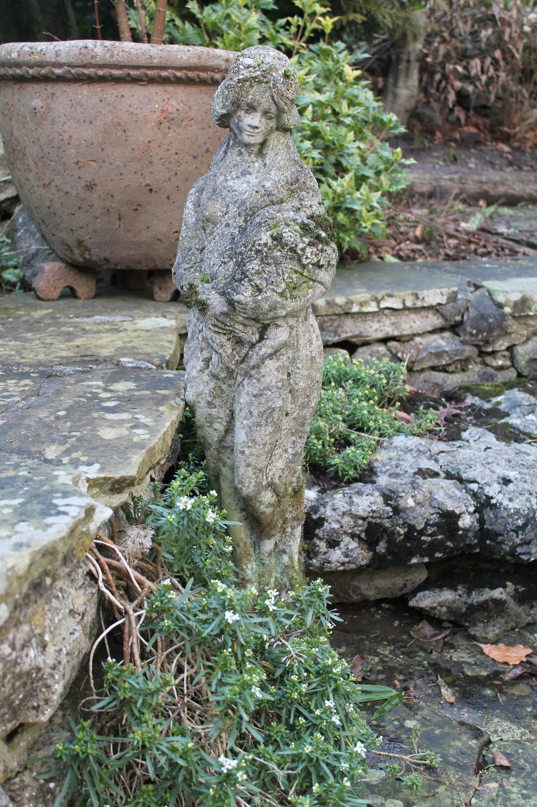 Garden Statue Of Flower Maiden. Reconstituted Stone photo vintage