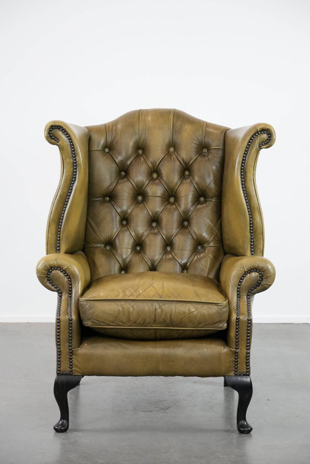 Moss Green Cowhide Chesterfield Wingback Armchair In English Style Finished With Decorative Nails photo furniture