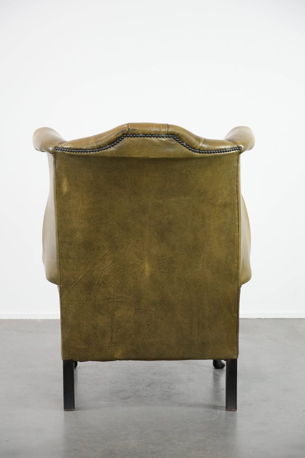 Moss Green Cowhide Chesterfield Wingback Armchair In English Style Finished With Decorative Nails photo Furniture