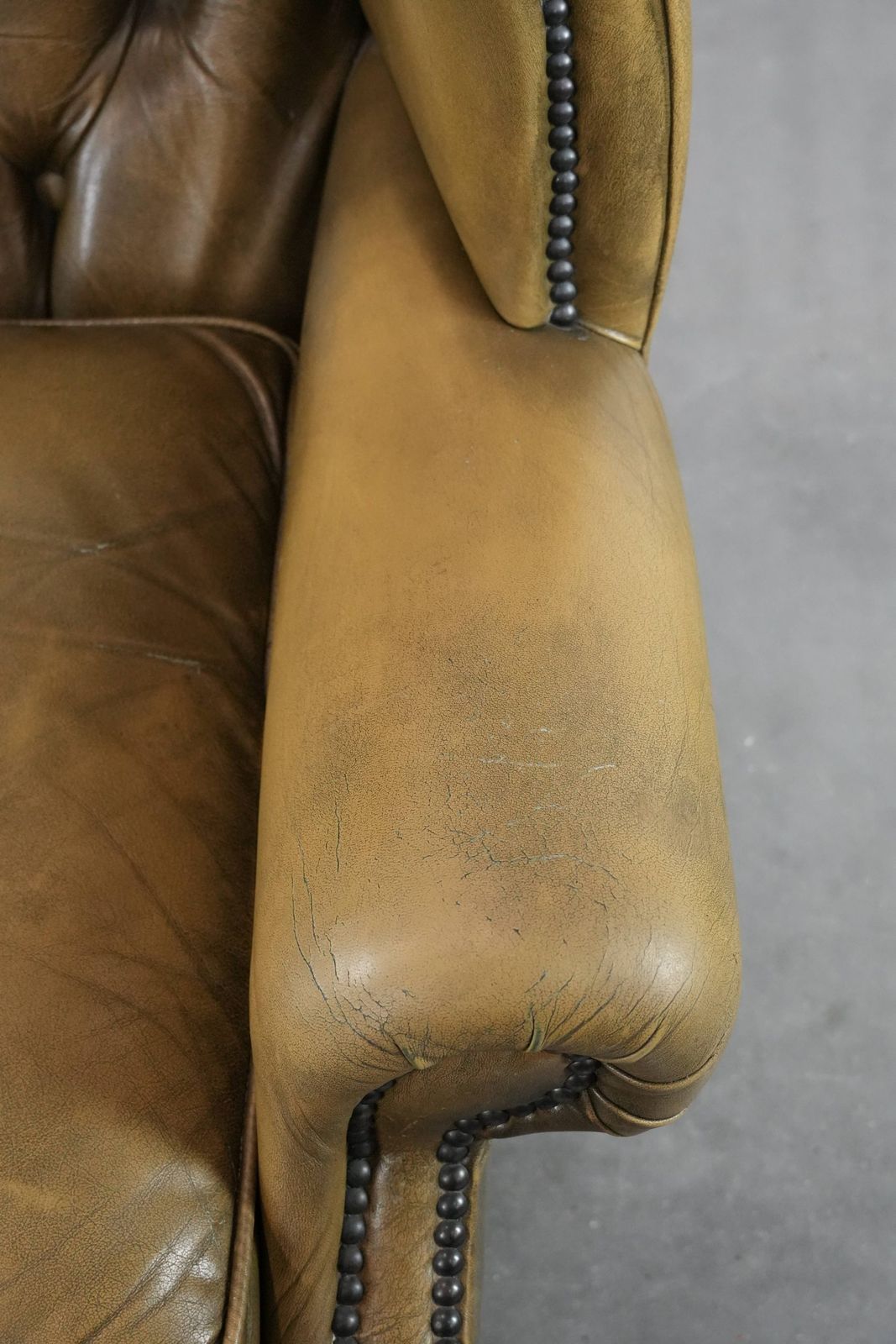 Moss Green Cowhide Chesterfield Wingback Armchair In English Style Finished With Decorative Nails photo vintage