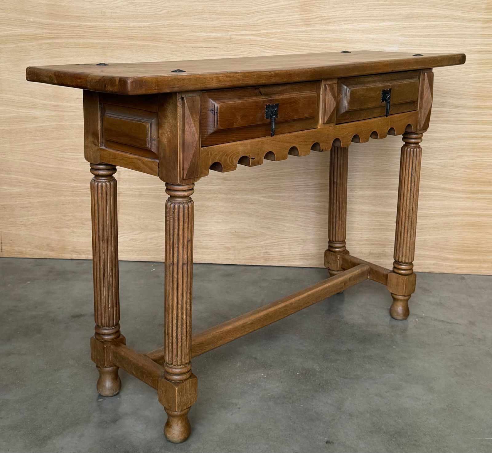 photo furniture Early 20th Century Spanish Carved Light Walnut Console Table With Fluted Legs