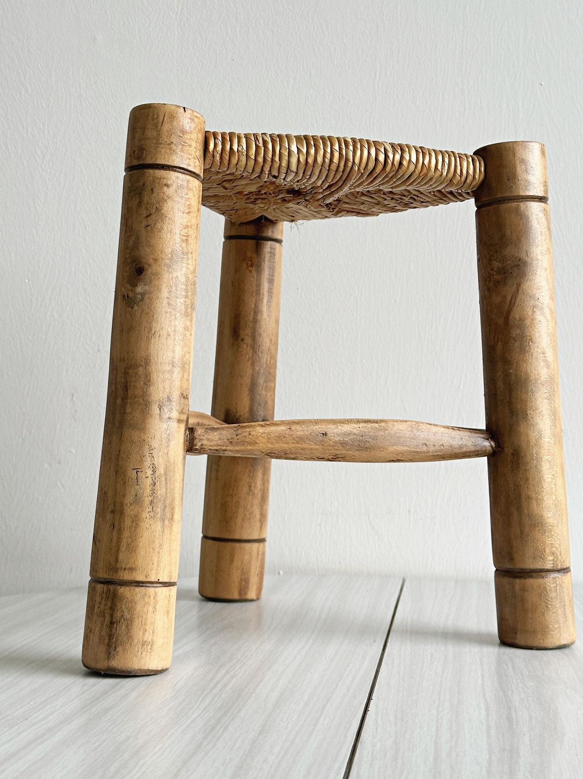 Antique Tripod Stool In Light Wood With A Woven Straw Seat, Rustic And Minimalist Piece Of Furniture, Cozy And Authentic Interior, Gift photo for sale