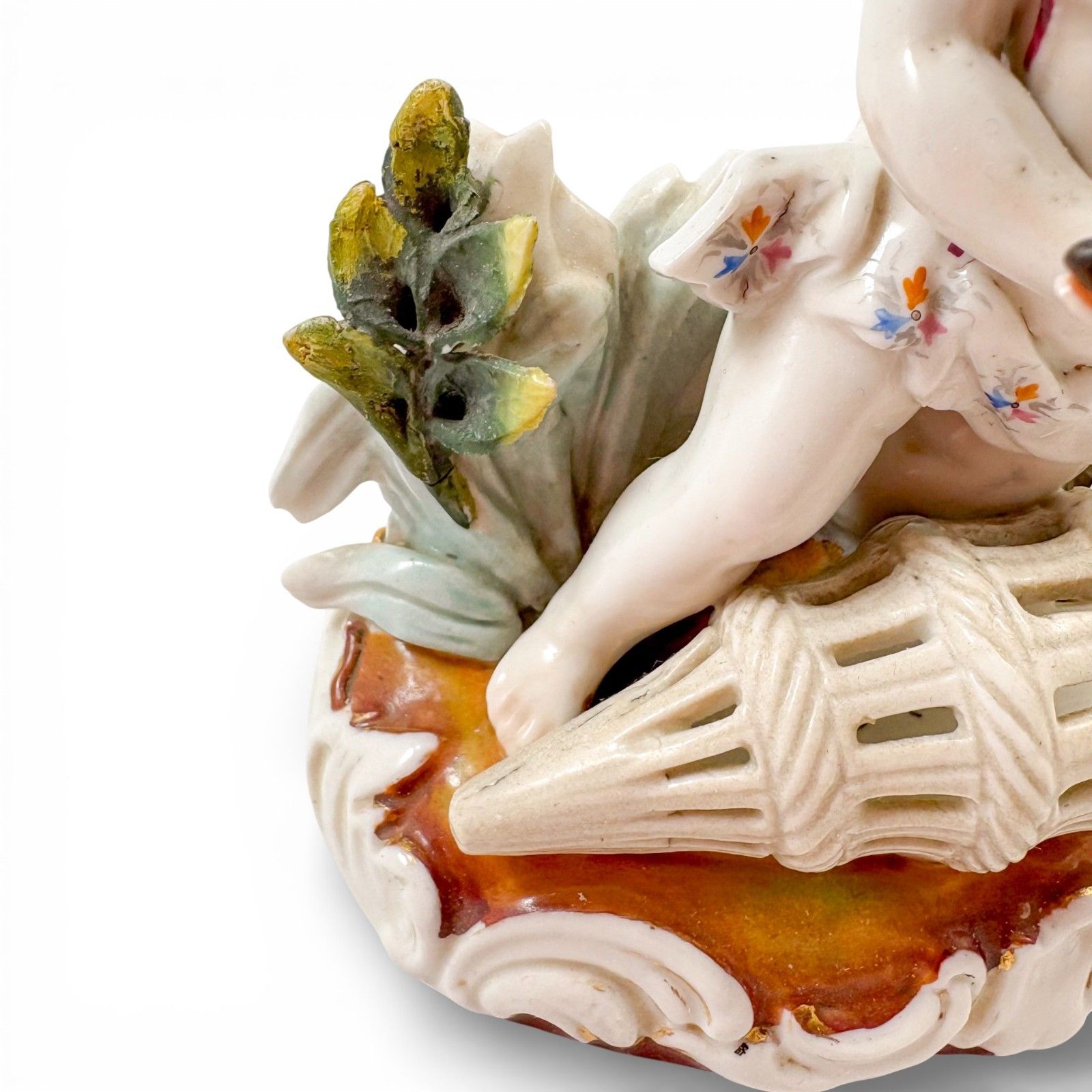 photo vintage Antique 19th Century Continental Porcelain Cherub Candlestick With Floral Stem