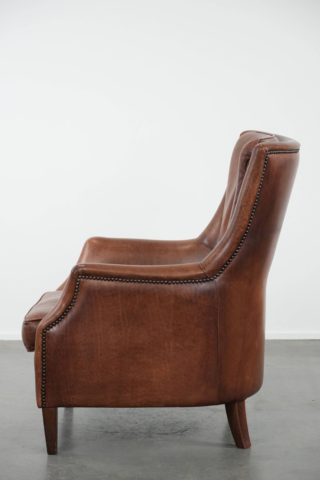 Very Comfortable And Luxurious Cognac Brown Cowhide Armchair With A Decorative Stud Finish photo 923.0