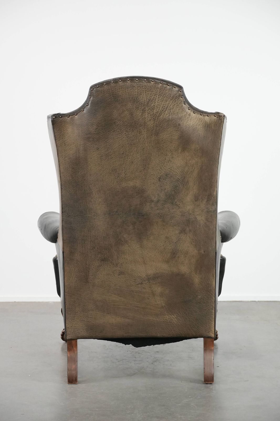 Large Antique Black English Cowhide Wing Chair From The Late 19th Century With A Luxurious Appearance photo Furniture