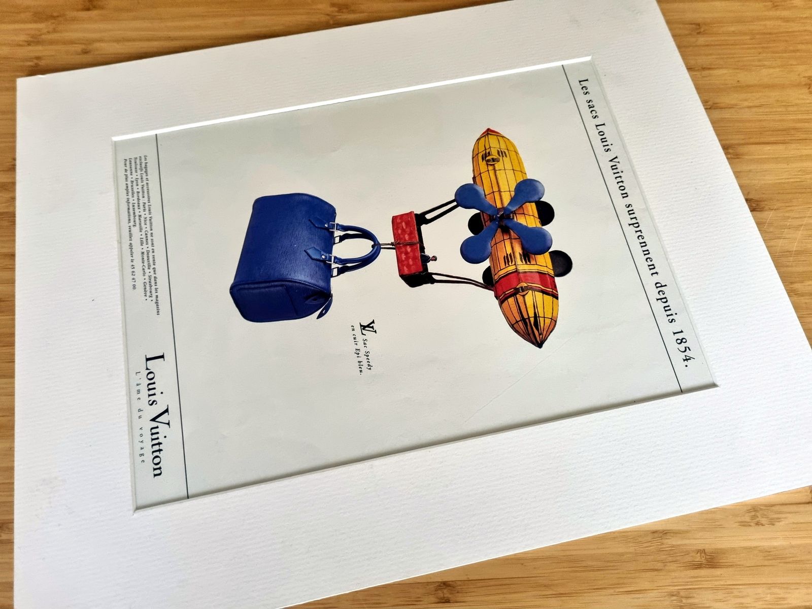 Vintage Fashion Advertisement, French Luxury Travel Decor, Louis Vuitton Speedy Bag Blue Image, Mounted Magazine Page In French photo furniture