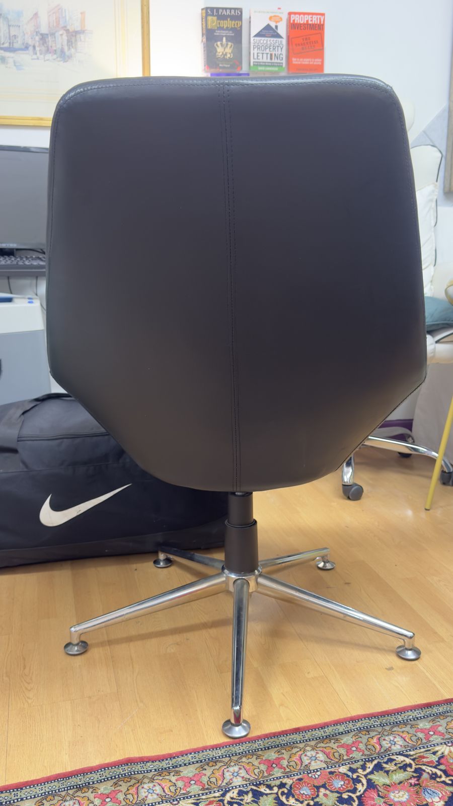 Retro High Backed Black Leather Swivel Armchair photo buy