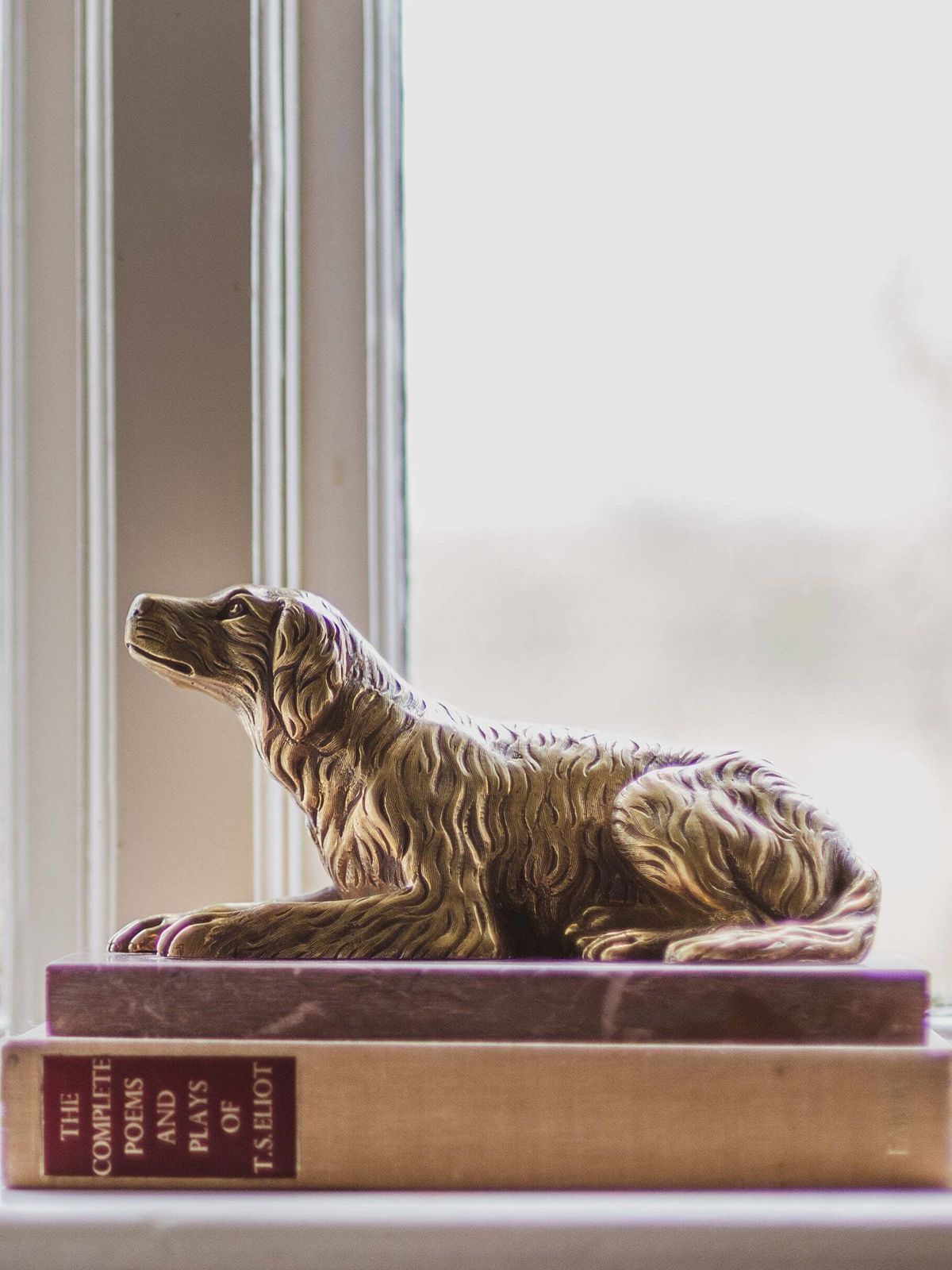 A 19th Century Gilt Bronze Study Of A Reclining Labrador Dog On A Rouge Marble Base