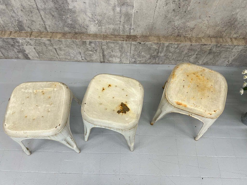 Set Of Three Stacking 1930's Style Tolix Cream Coloured Metal Stools photo vinterior