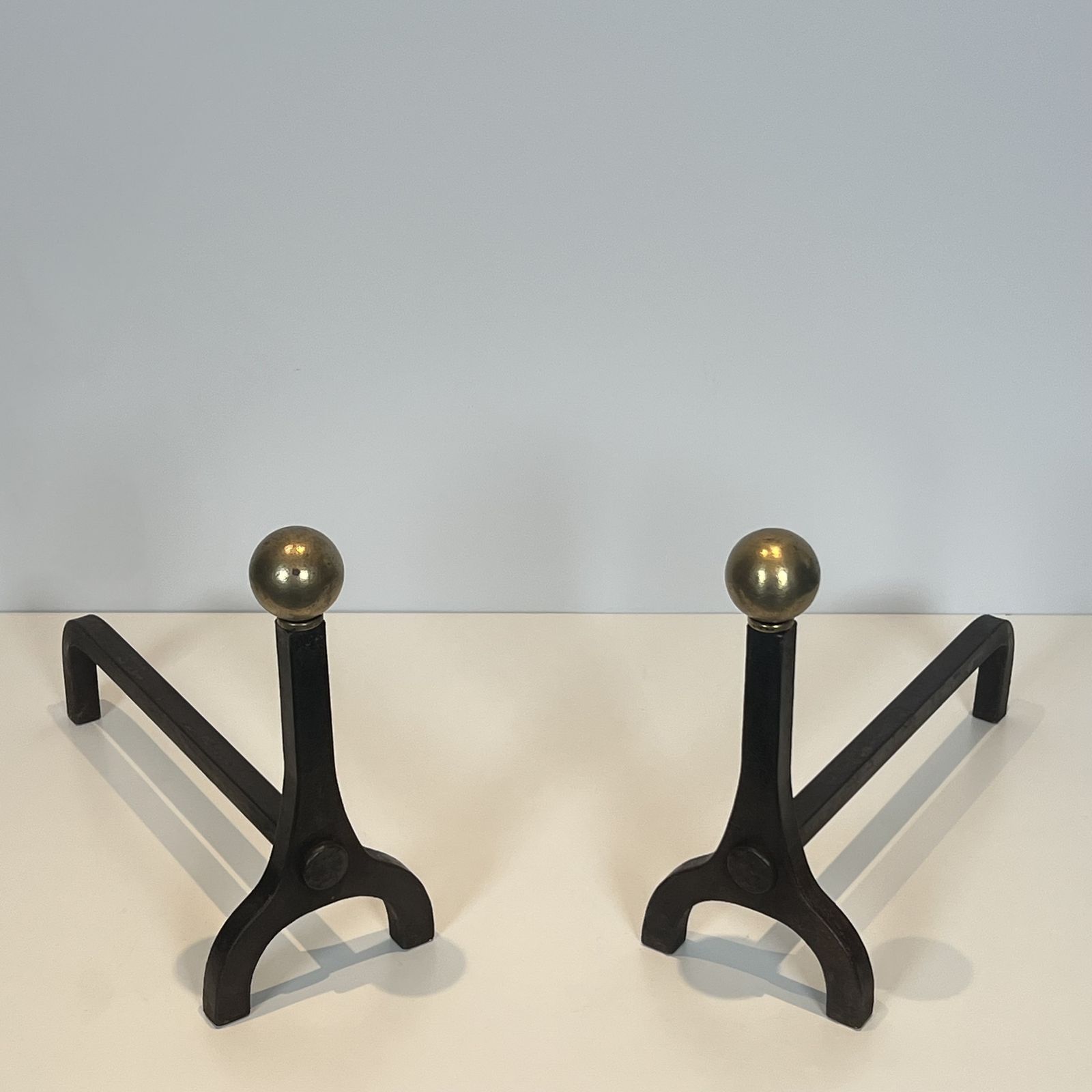 Pair Of Modernist Andirons In Steel, Wrought Iron And Brass By Jacques Adnet photo for sale