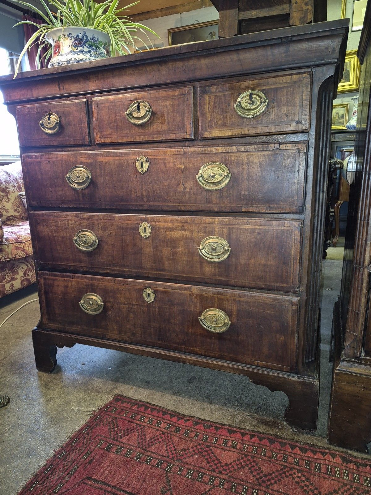 A Great George II Crossbanded Figured Walnut Chest Of Drawers On Bracket Feet