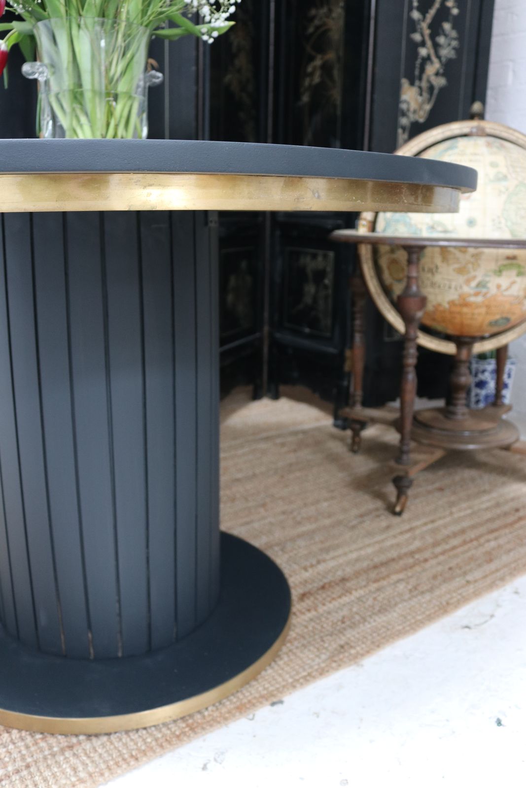 Stunning Black Round Dining Table With Brass Metal Edge Slatted Wood Column Base photo 250.0