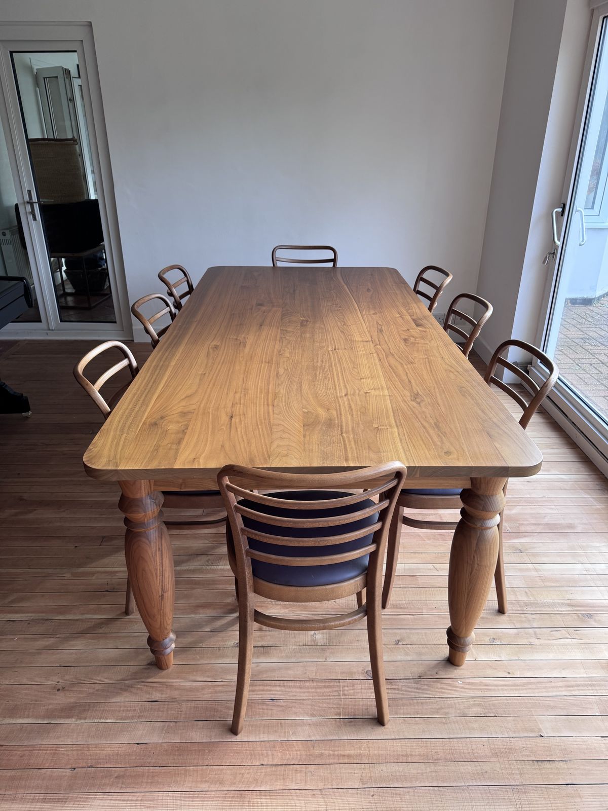4950.0 Benchmark Mrs B Dining Table In Walnut Designed By Russel Pinch With 8 Leather Upholstered Vienna Dining Chairs photo