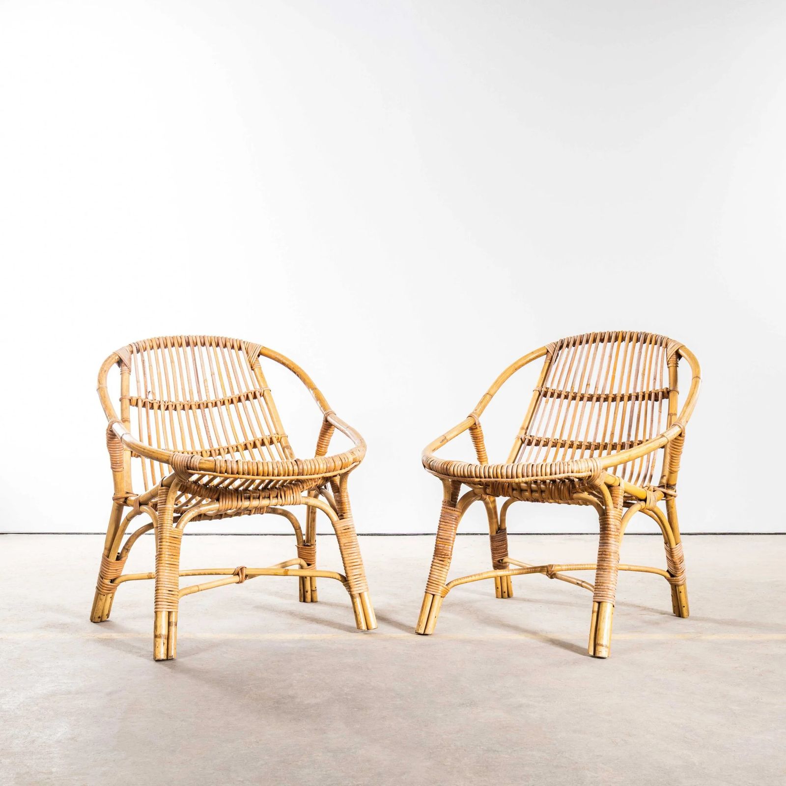 1960’s French Low Seat Rattan Armchairs – Pair