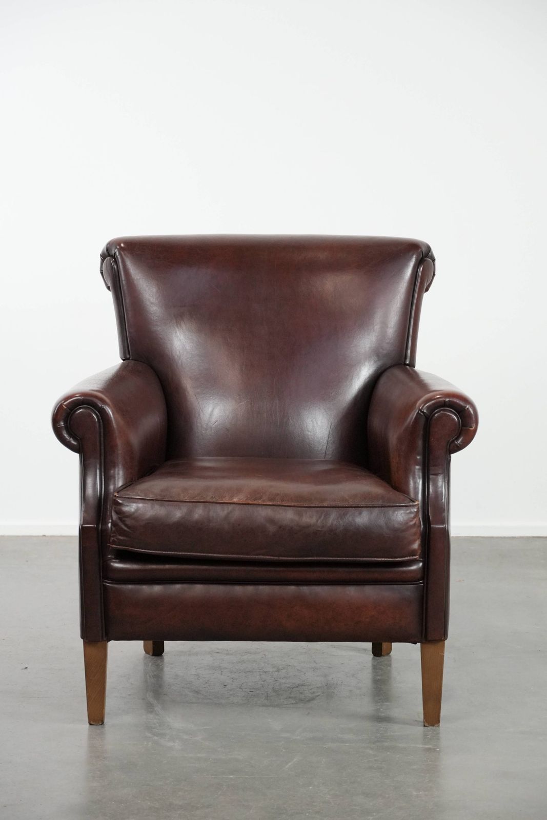 Luxurious Sheepskin Armchair With A Timeless Look And A Beautiful Dark Color photo furniture