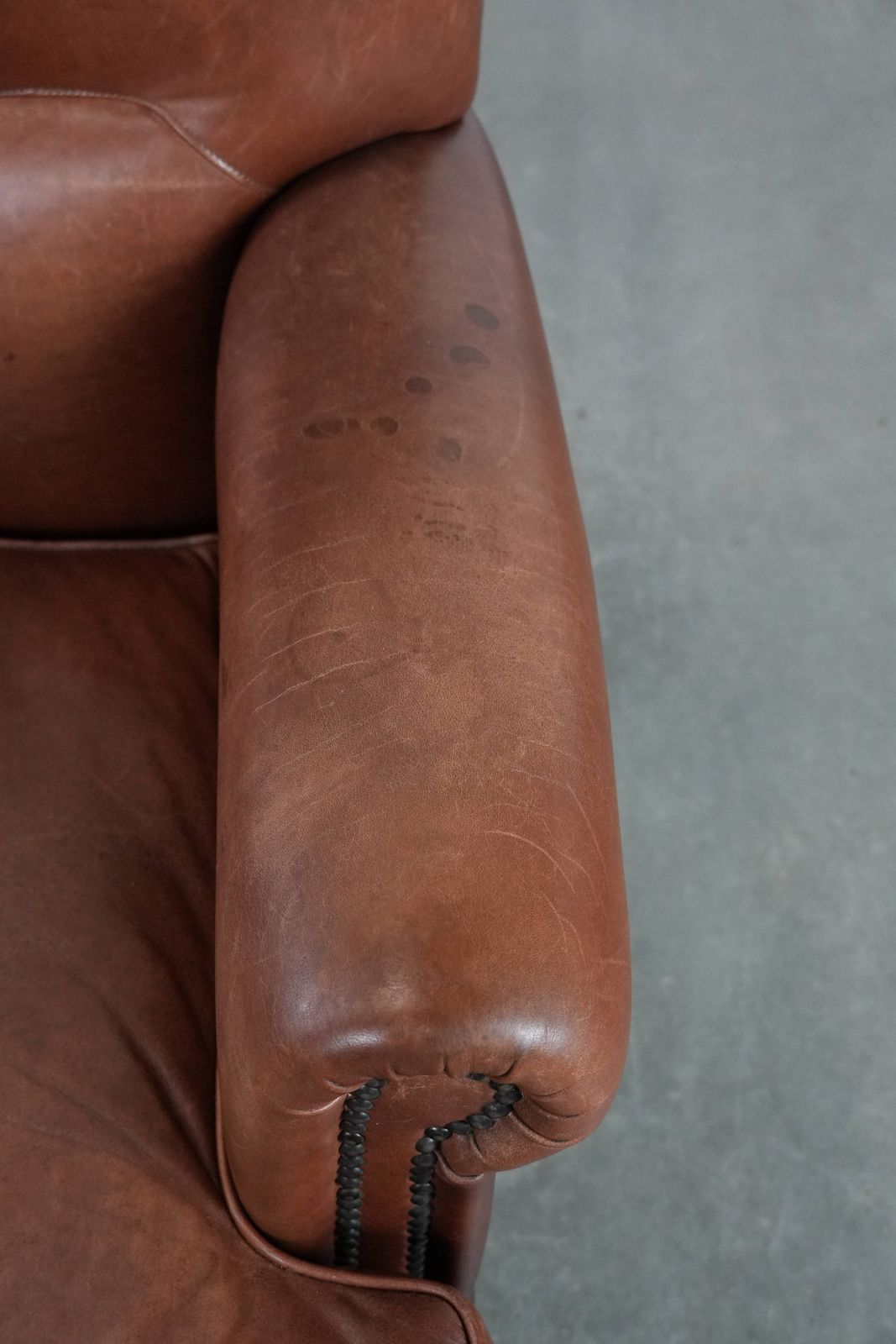 Nice And Comfortable Armchair Made Of Cognac Colored Cowhide In English Style photo vintage