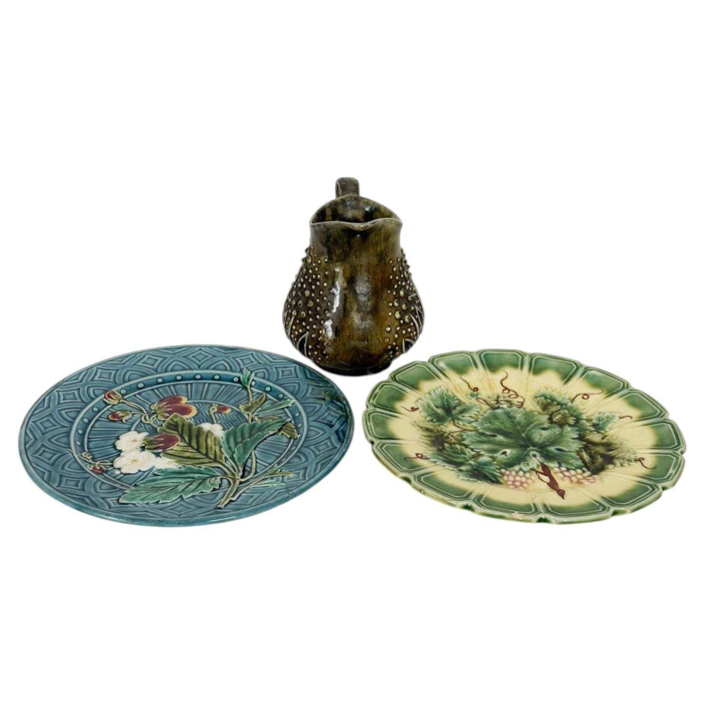 Set Of Majolica Plates Signed With Floral Motifs And A Pitcher