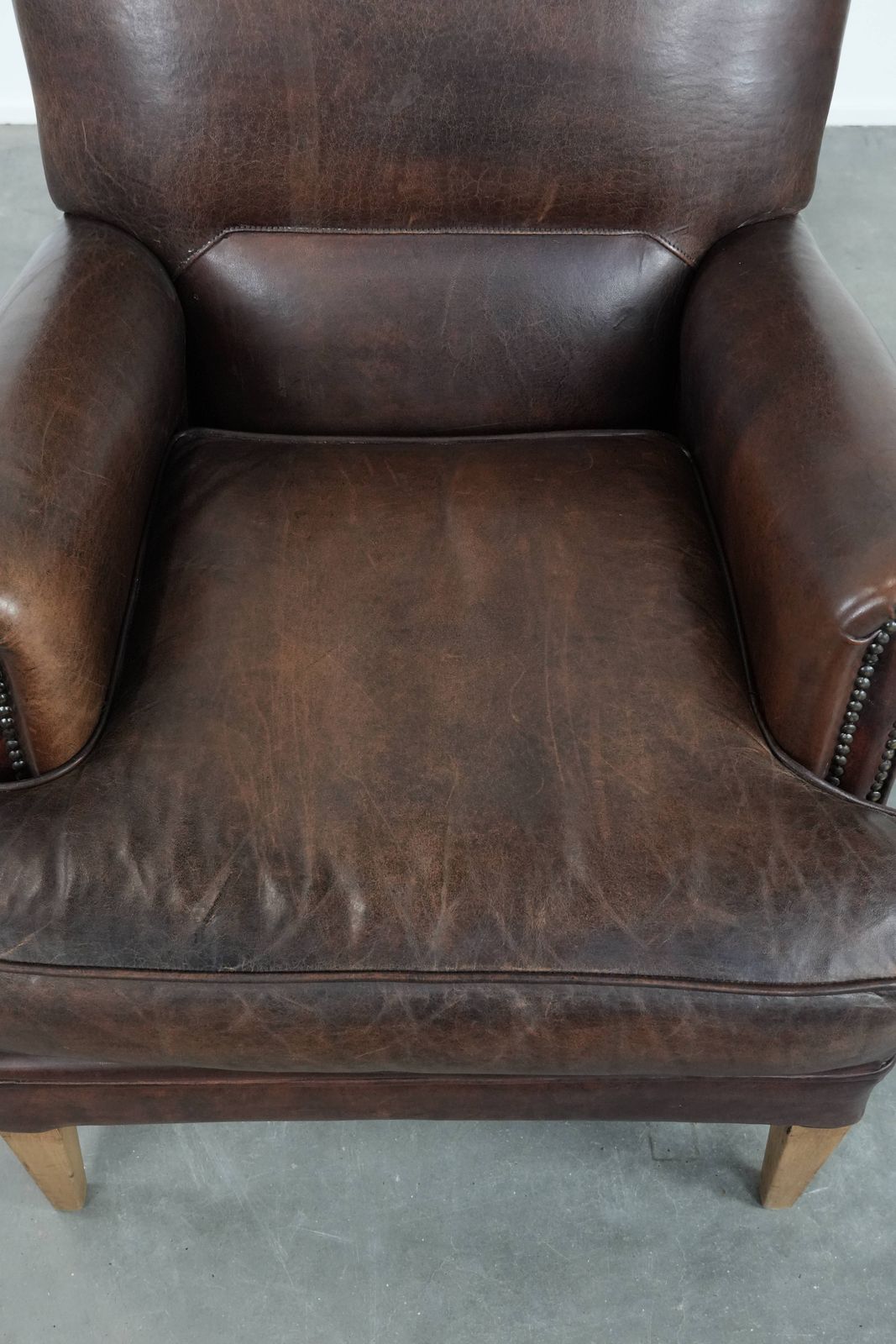 Characterful Sheepskin Armchair With A Beautiful Deep Color photo vinterior