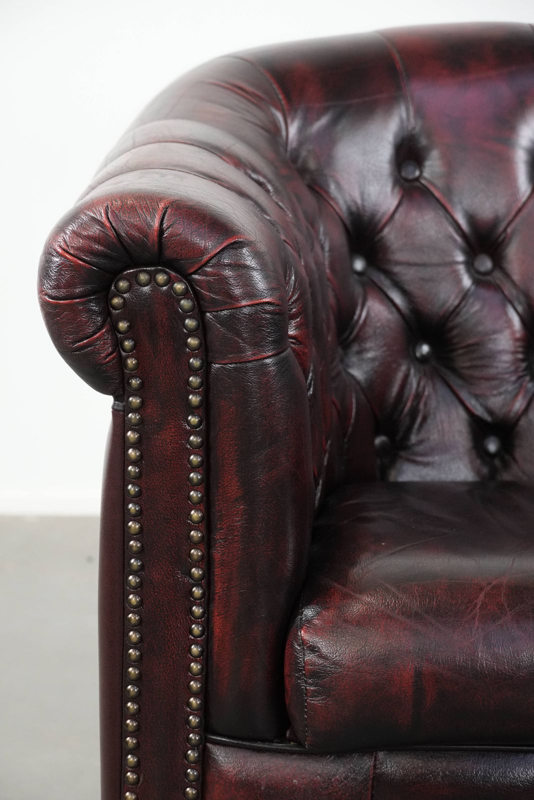 photo furniture Cowhide Chesterfield Club Armchair In Classic English Style, Finished With Decorative Studs