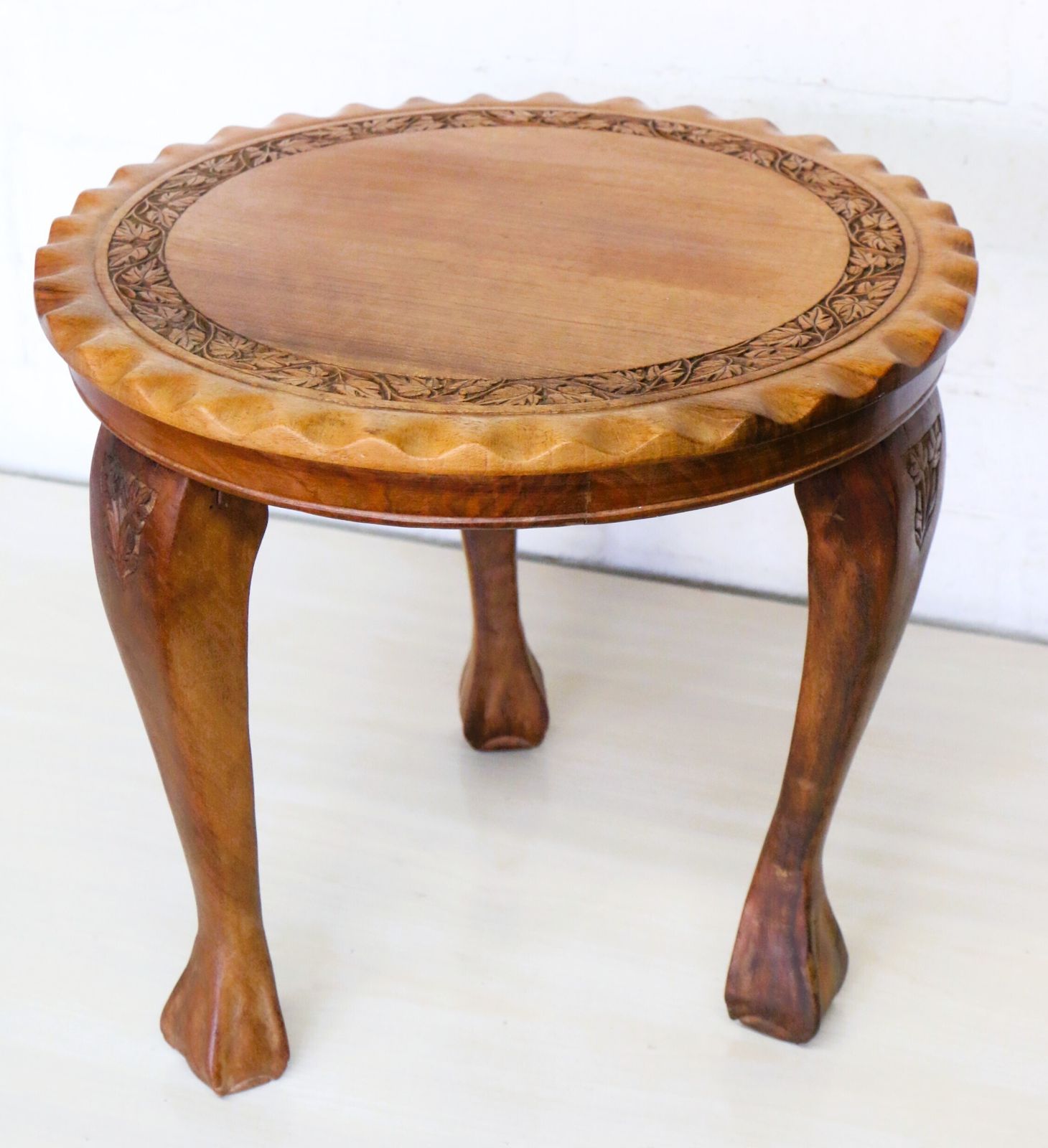 photo vintage A Vintage Small Occasional Round Table Made From Teak With Carved Detailing Hand Made S.E.Asia