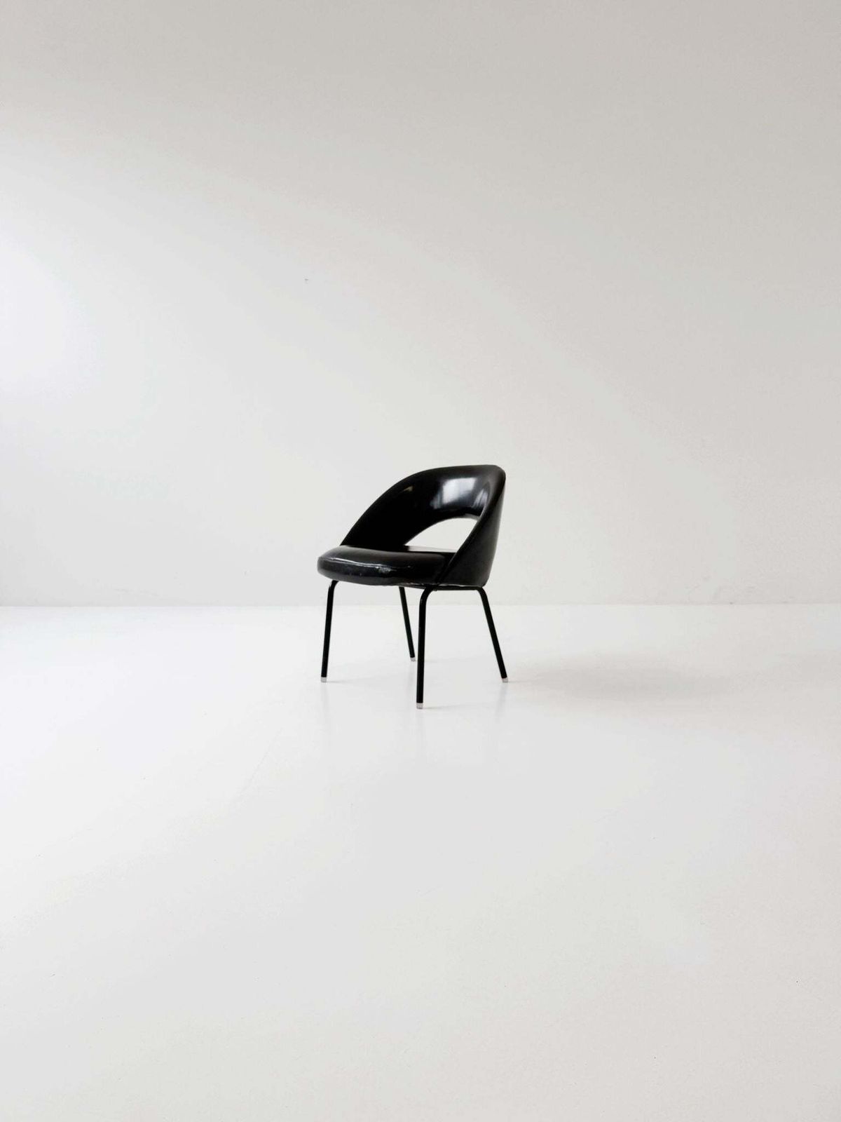 Black Armchair With Shaped Shell – 1970s photo furniture