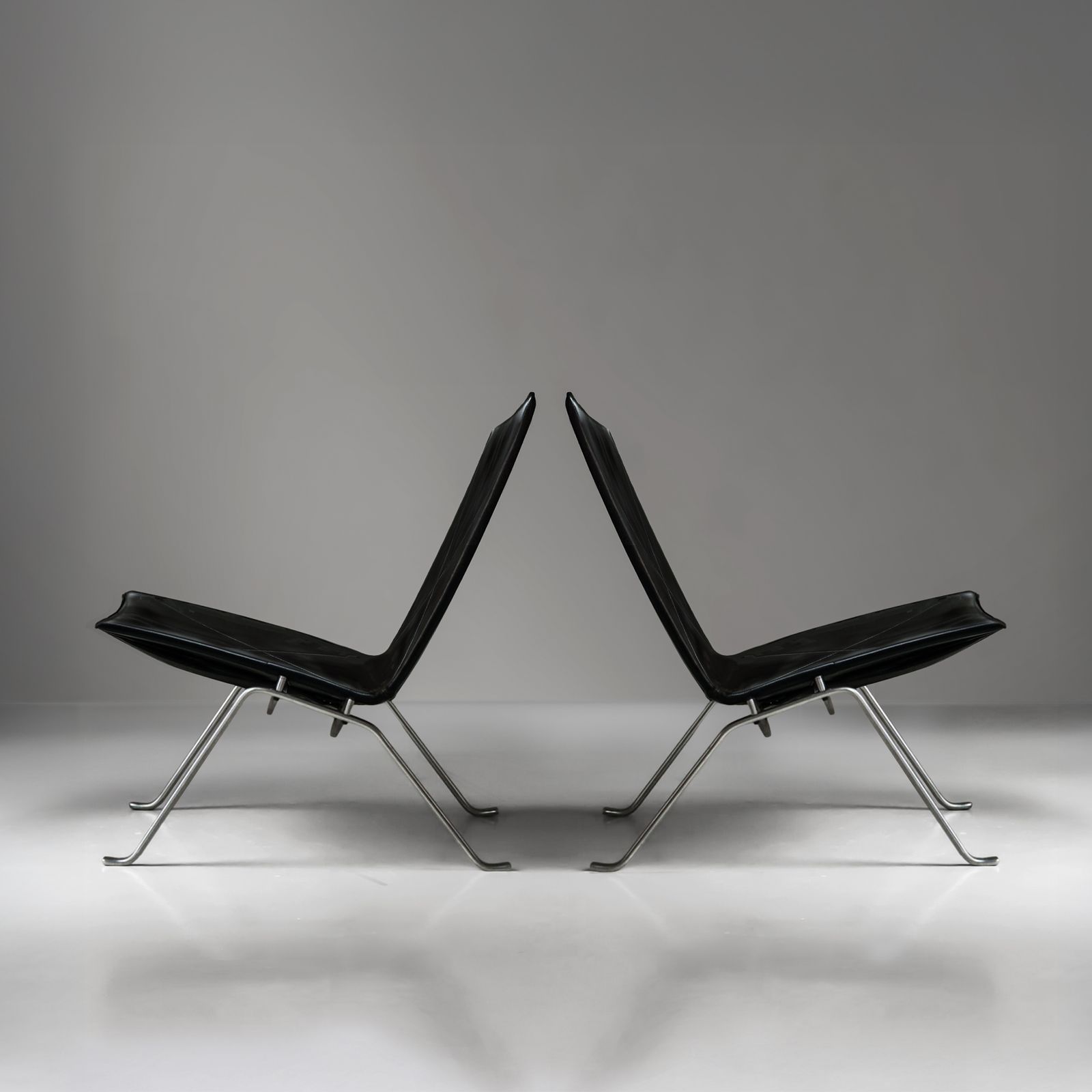 Pair Of Black Leather And Polished Steel Danish Mid Century Poul Kjaerholm Pk22 Lounge Chairs For E. Kold Christensen 1960s. photo for sale