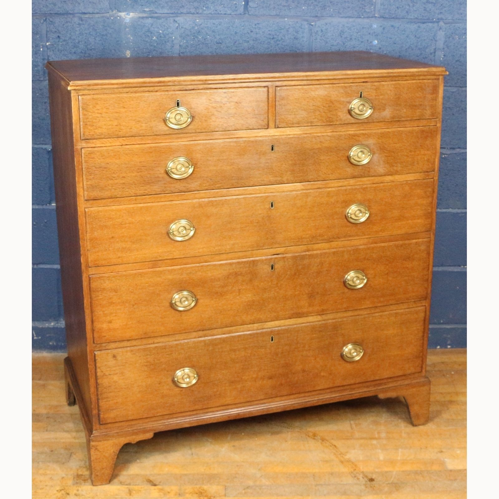 A Georgian Oak Two Over Four Chest Of Drawers Raised On Bracket Feet photo furniture
