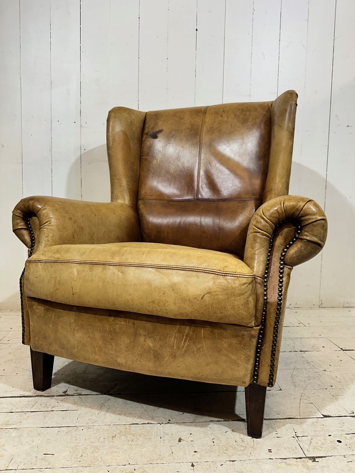 449.0 Vintage Hotel Lounge Wingback Armchair In A Distressed Aniline Leather photo