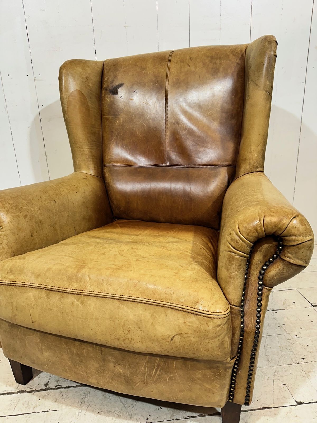 photo vinterior Vintage Hotel Lounge Wingback Armchair In A Distressed Aniline Leather